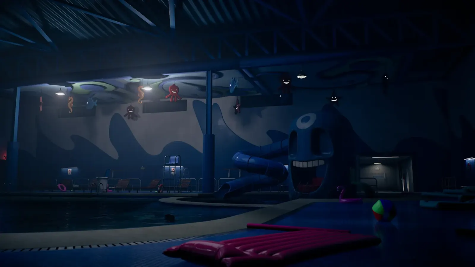 An empty indoor pool at night